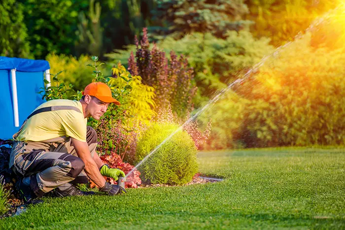 a landscapper fixing water | landscaping services